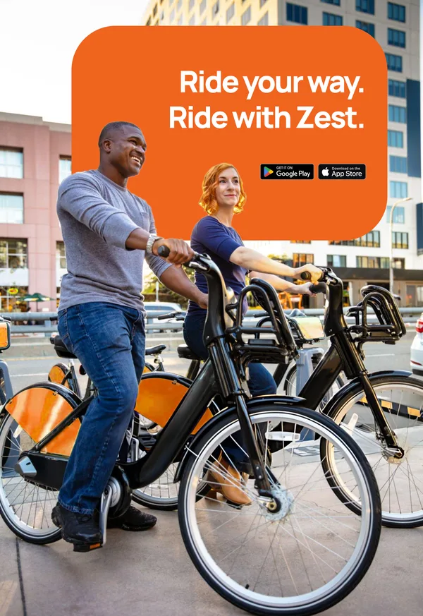 Two riders sharing a laugh on ZestRyde bikes